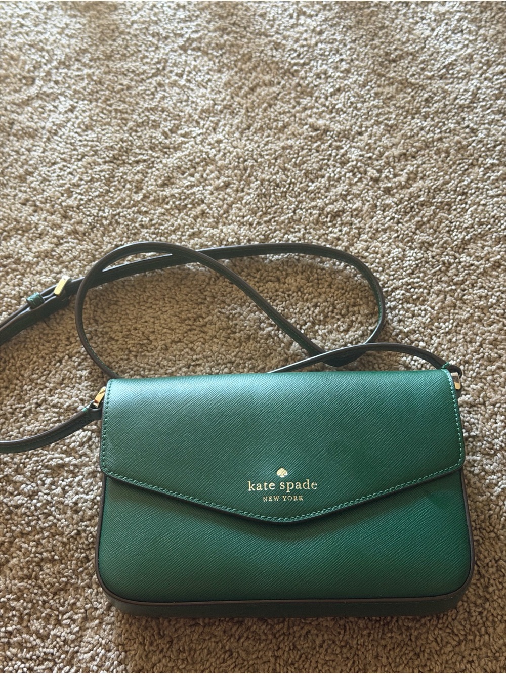 kate spade emerald green leather crossbody with gold logo